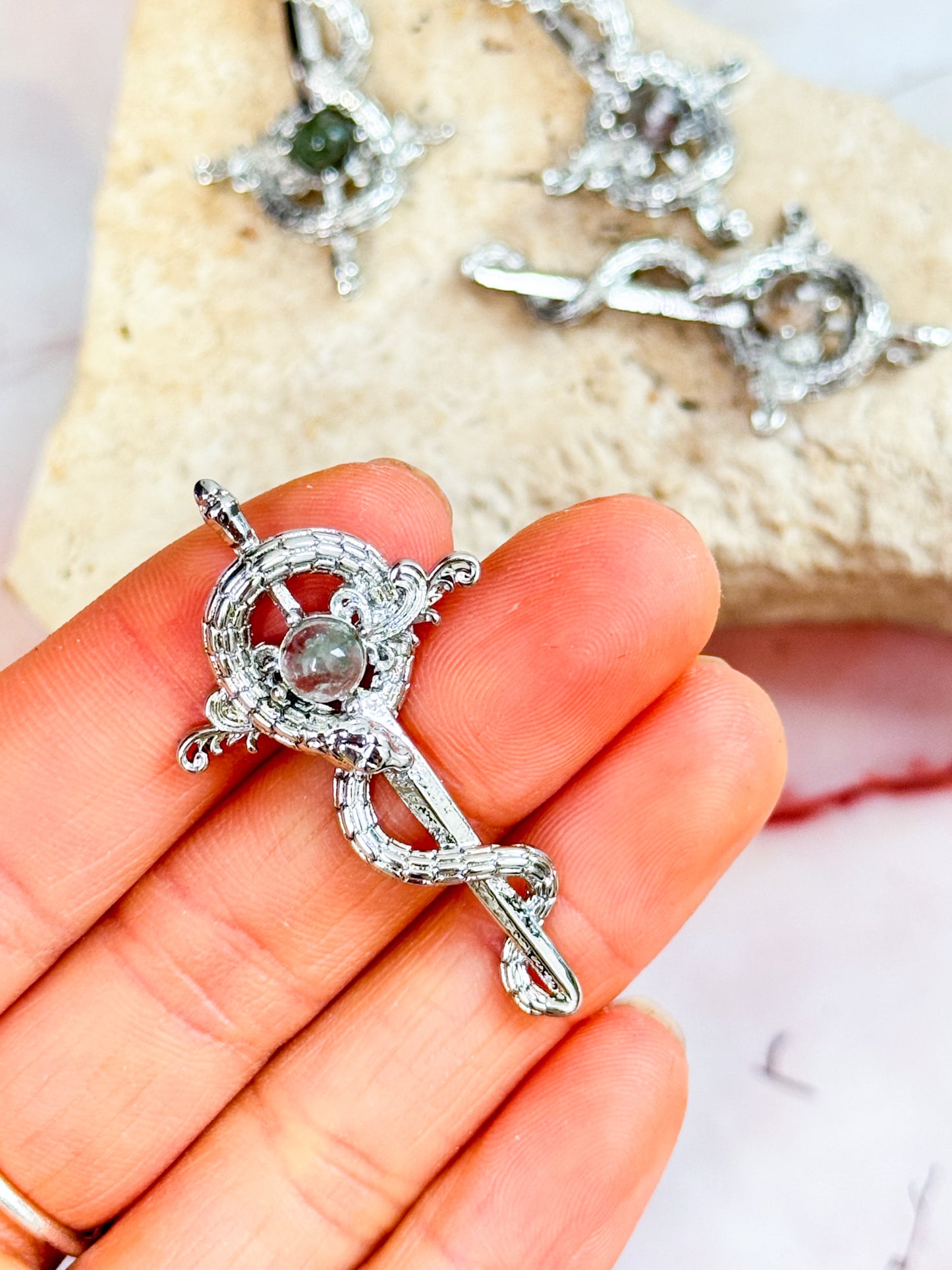 Garden Quartz Snake and Sword Pendants