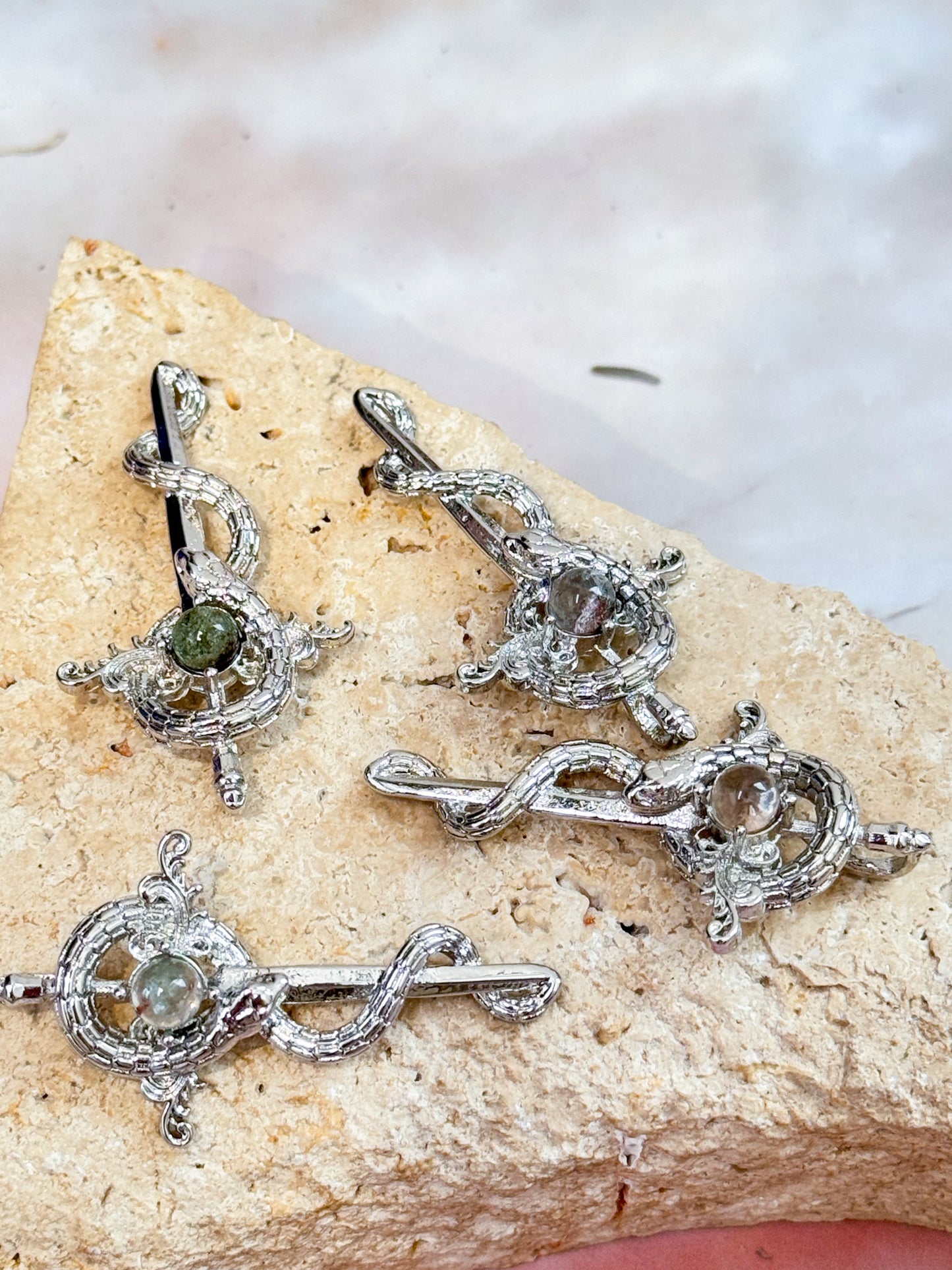 Garden Quartz Snake and Sword Pendants