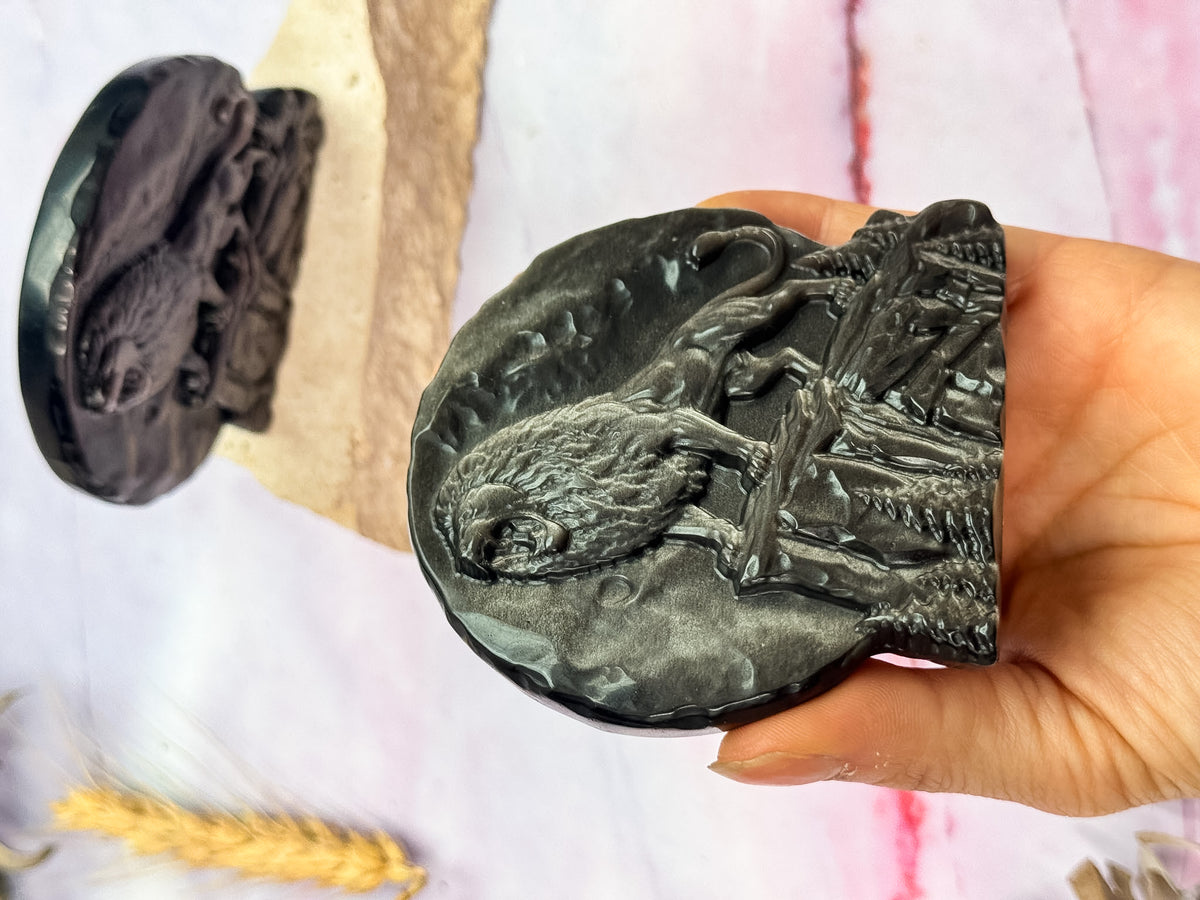 Silver Sheen Obsidian Lion Carvings
